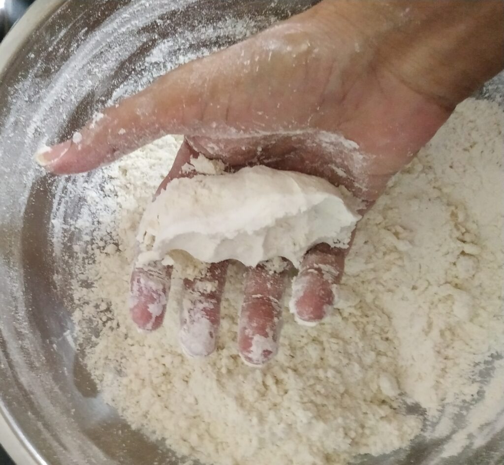 Checking the fist impression on the dough lump